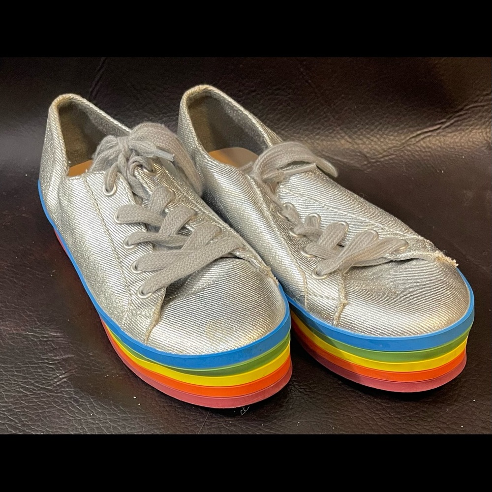 Metallic silver sneakers with rainbows on the bottom. Size 3